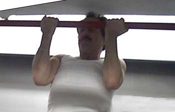 Barry Newton, the Bearmonster, doing chinups.